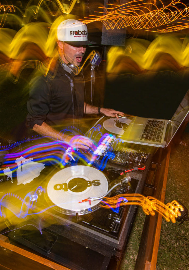 DJ Nate with turntables at wedding